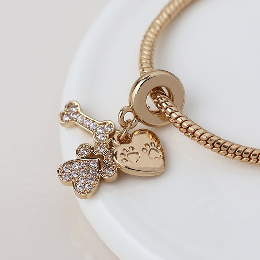 Faux Gold Plated Slider Charm Bracelet with Crystal Heart and Paws Charm