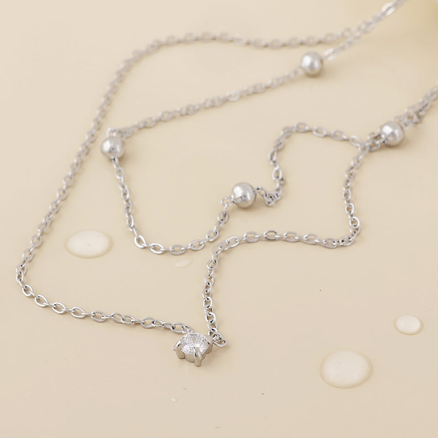 Zenith Stainless Steel Platinum Plated Layered Station and Crystal Necklace